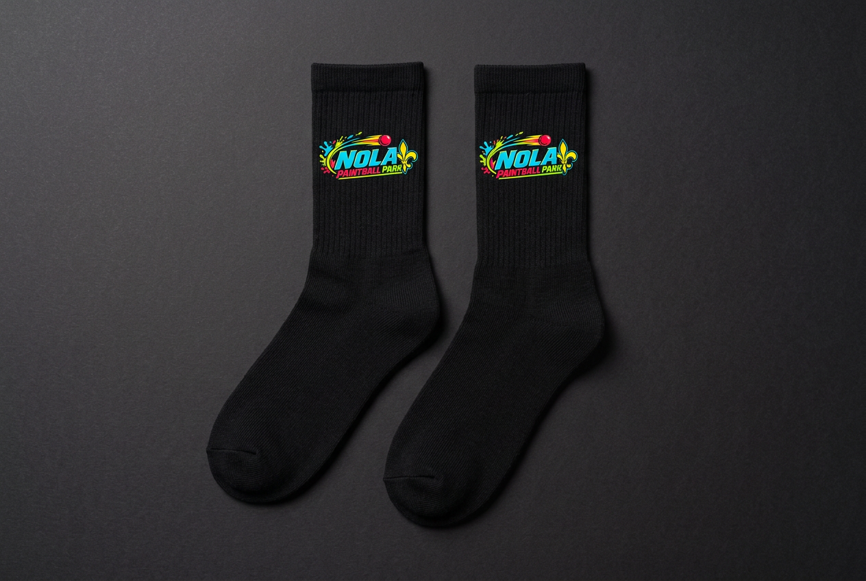 Black crew socks printed with the NOLA Paintball Park logo