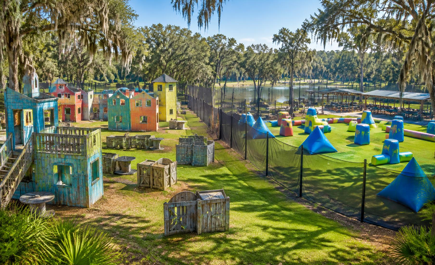 Colorful paintball fields surrounded by Louisiana oak trees